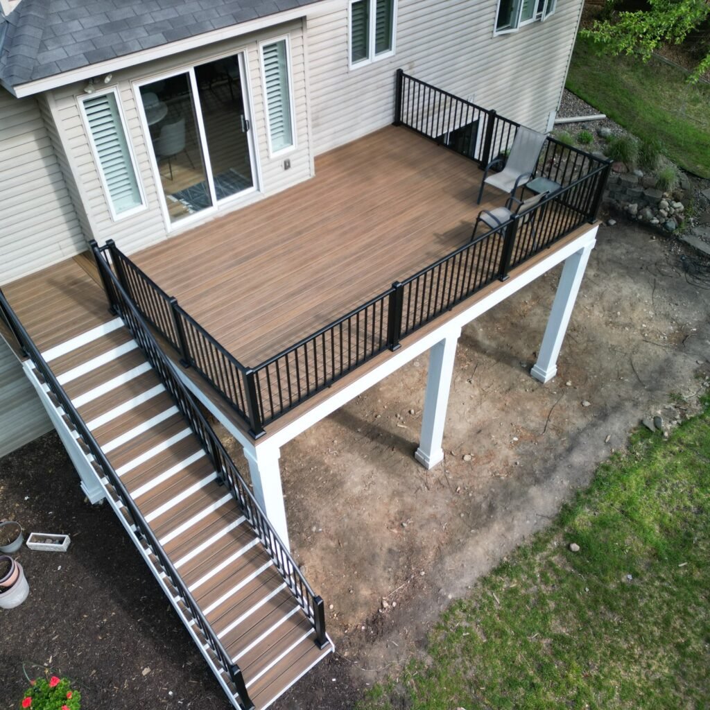 paradise deck builders oshawa - composite brown deck with long stairs