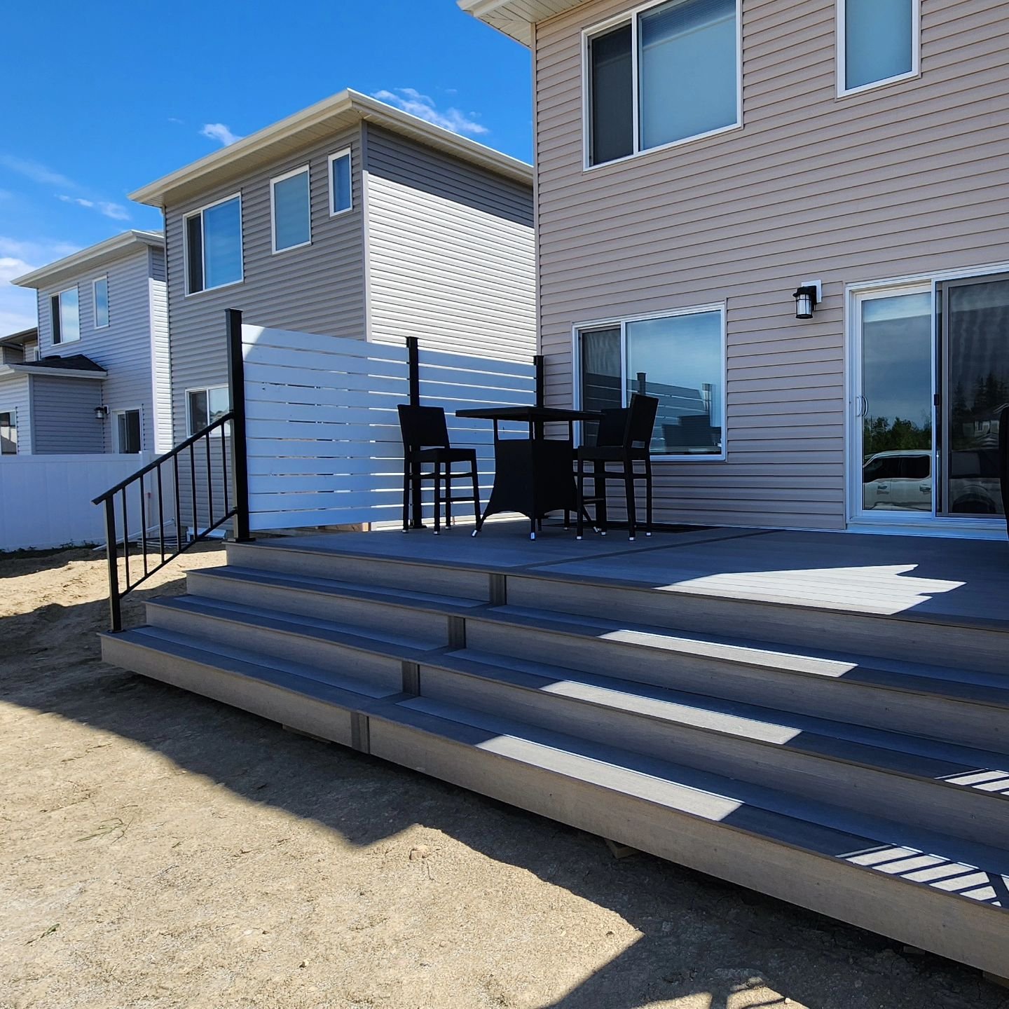 paradise deck builders oshawa - grey composite deck with privacy wall