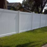 white vinyl fence