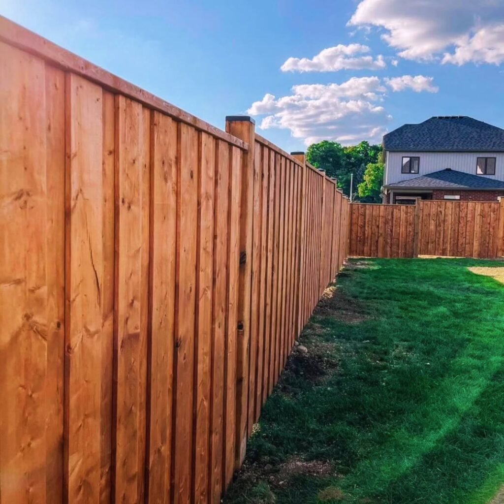 paradise deck builders and fence installers stained wood fence in backyard
